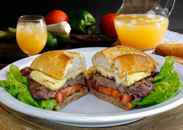 istock French bread sandwich with steak, cheese, tomato and orange juice 1138804050