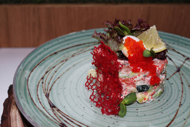 salad with red caviar and cheese chips