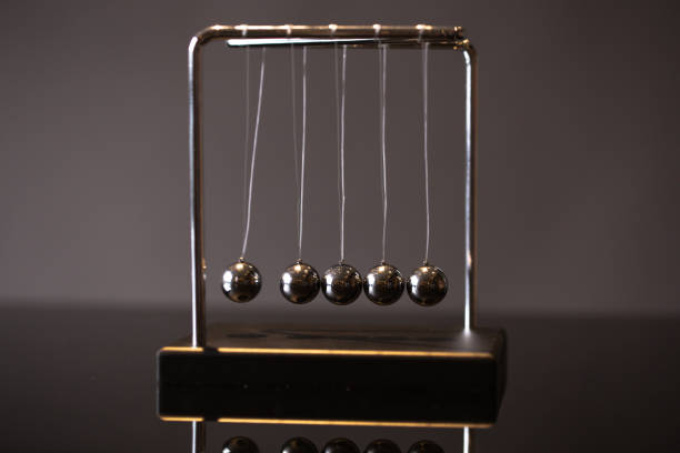 istock Newton cradle representing momentum 1138808214