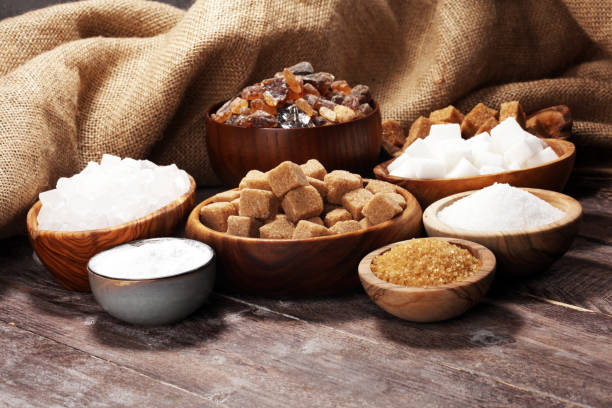 istock Various types of sugar, brown sugar and white on rustic wooden table 1138809089