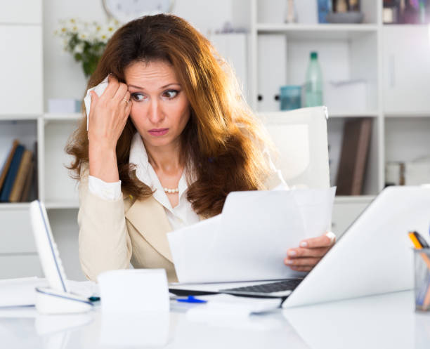 istock Adult woman is crying because of problems with documents 1138809166