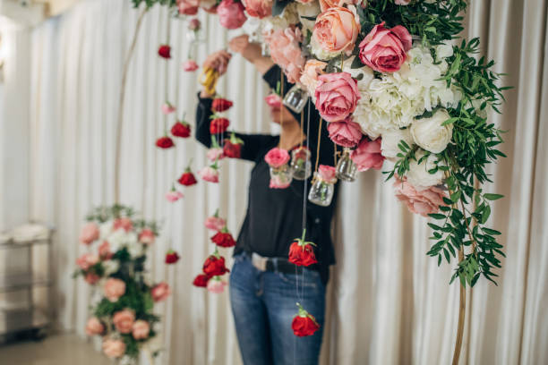 istock Woman arranging flowers for wedding 1138809199