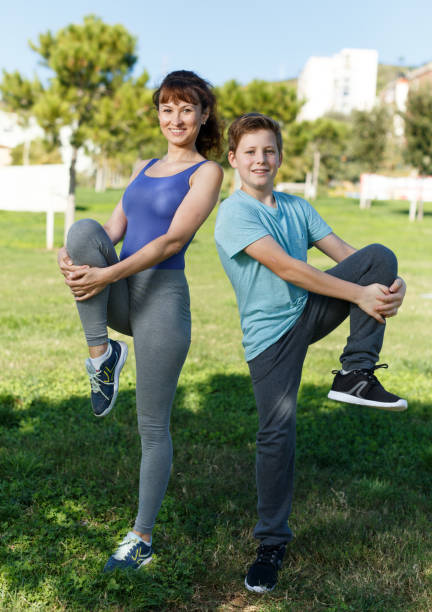 istock Mother and son stretching outdoors 1138809207