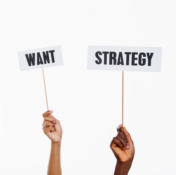 istock Two raised hands holds signs 