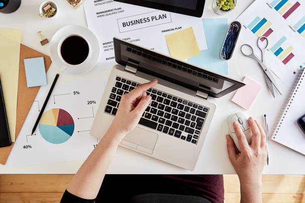 istock Businesswoman analyzing data with laptop 1138813602