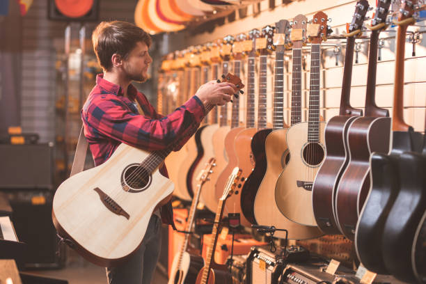 istock Young man in a music store 1138813624