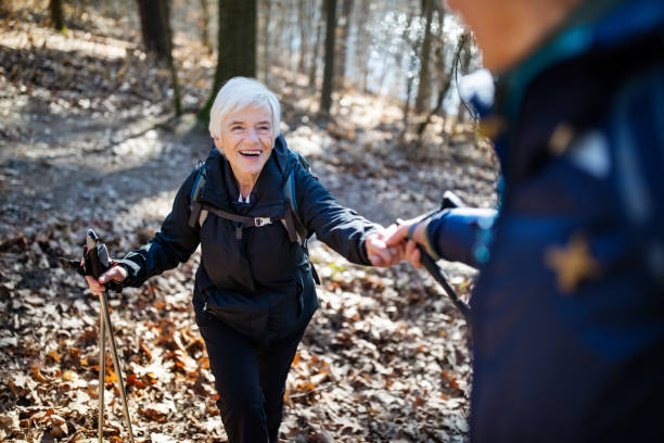 istock Elderly couple hiking together 1138814007