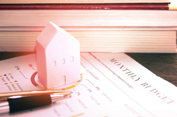istock House model and pen on housing spending document , business concept 1138817817