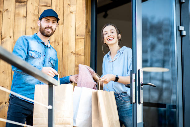 istock Delivery man bringing goods home for a woman client 1138823003