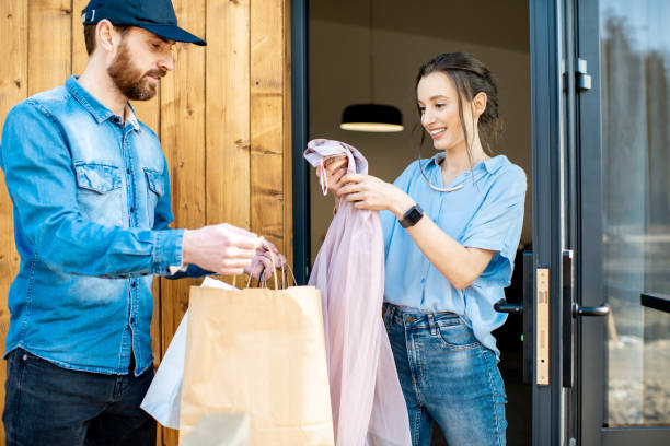 istock Delivery man bringing goods home for a woman client 1138823019