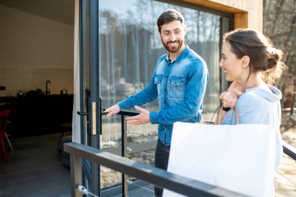 Couple entering home after the shopping