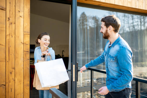 istock Couple entering home after the shopping 1138823627