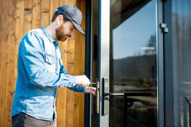 Photo of Man repairing door lock