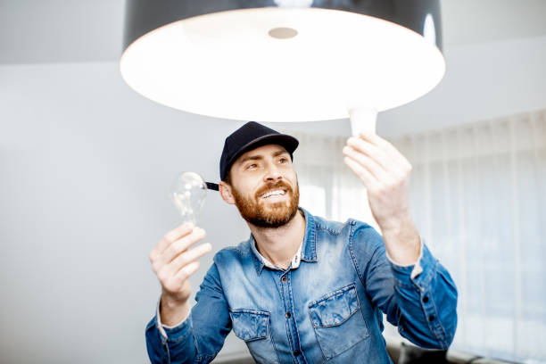 istock Man changing lamps in the apartment 1138823823