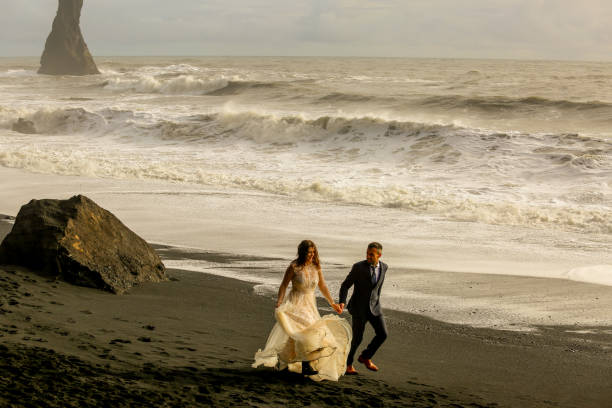 istock Beautiful wedding couple posing on beach 1138824292