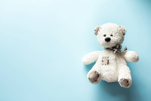 istock teddy bear child toy on pastel baby blue background with copy space 1138825045