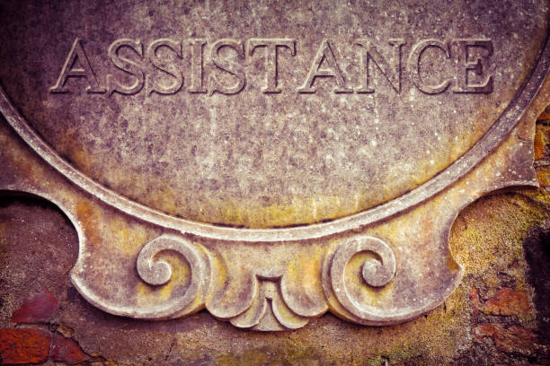 istock Assistance text written on old stucco wall - concept image 1138825339