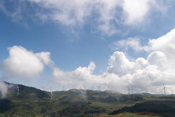 istock Wind turbines against a backdrop of blue sky and white clouds 1138825721