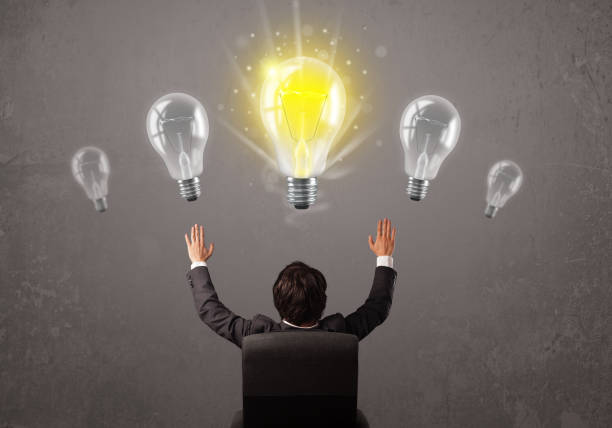 istock Business person having an idea light bulb concept 1138830132