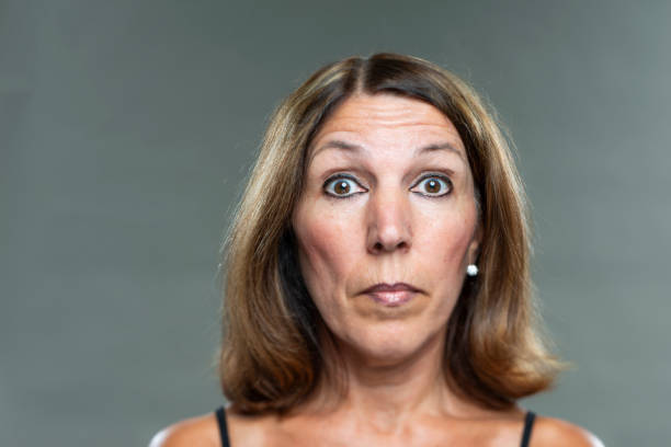 istock Senior woman looking surprised 1138830295