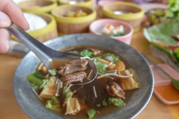 Photo of Bak kut teh or meat bone tea, delicious soup in southern of Thailand