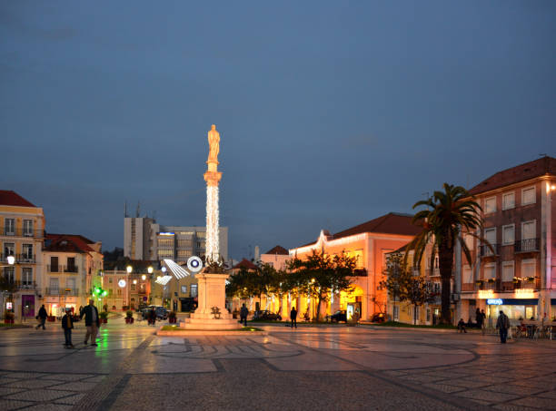 Setubal main square, Bocage Square, Portugal Setubal, Portugal: the main square at night, Praça do Bocage -  City Hall on the right and 19th century statue of poet Manuel Maria Barbosa du Bocage in the center setúbal city portugal stock pictures, royalty-free photos & images