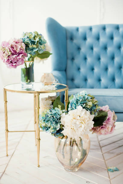 istock vintage blue sofa and bouquets of hydrangea 1138832675