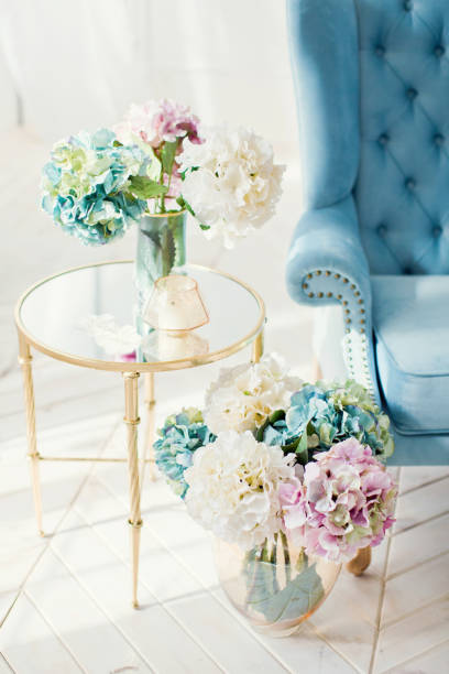 istock vintage blue sofa and bouquets of hydrangea 1138832775