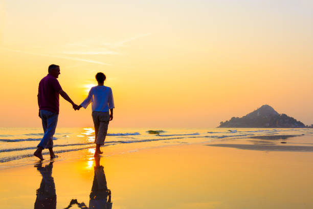 istock Senior Couple Enjoying Beach Holiday 1138833066
