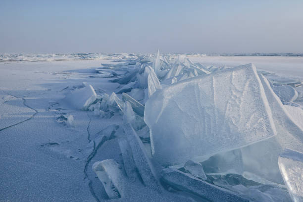 istock crack in the ice and standing vertically ice on lake Baikal 1138833379