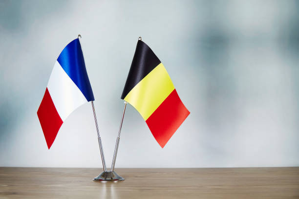 istock French and Belgian flag standing on the table 1138834095