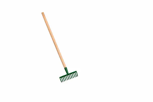 Small gardening rake isolated on white background