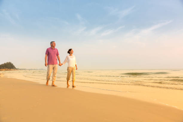 istock Senior Couple Enjoying Beach Holiday 1138836107