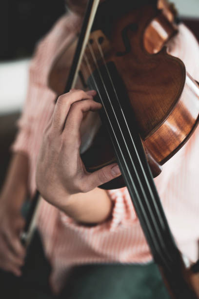 istock Close-up hand woman playing the violin 1138837321