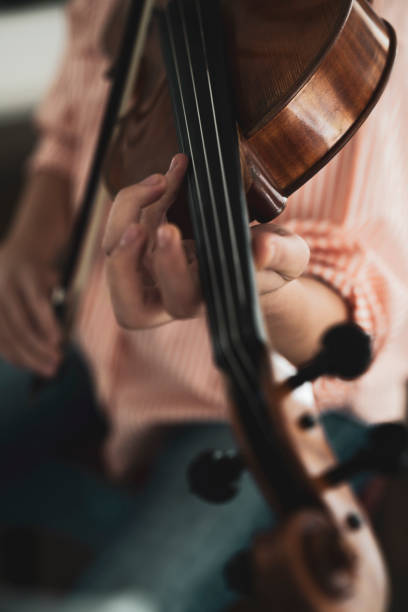 istock Close-up hand woman playing the violin 1138837326