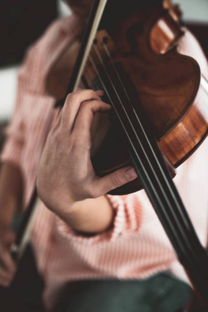 istock Close-up hand woman playing the violin 1138837440