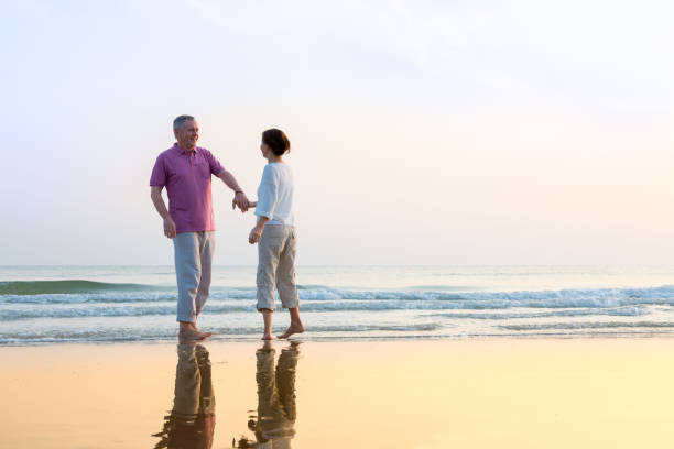 istock Senior Couple Enjoying Beach Holiday 1138837505