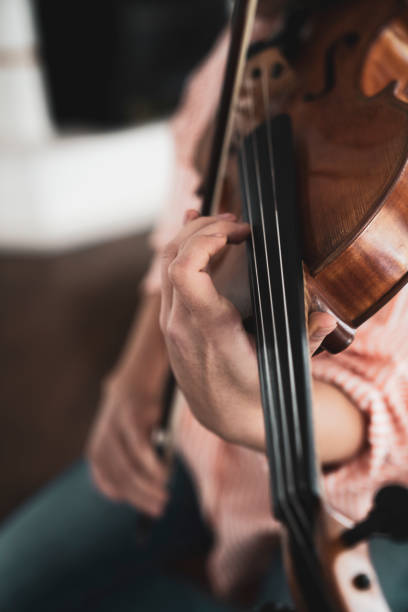 istock Close-up hand woman playing the violin 1138837510