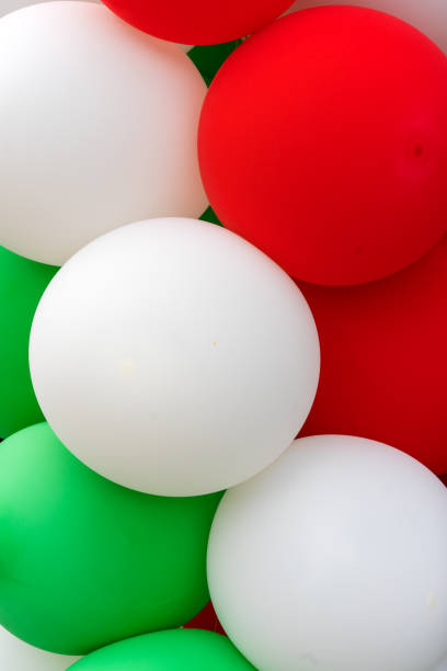 istock Many colorful balloons decorated wall as background 1138837565