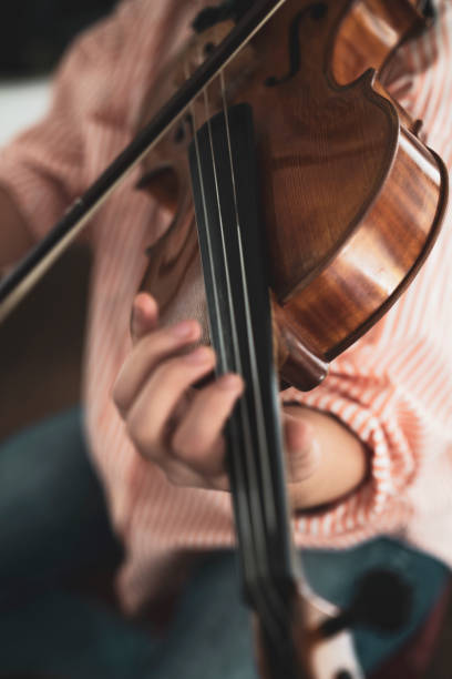 istock Close-up hand woman playing the violin 1138837629