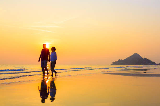 istock Senior Couple Enjoying Beach Holiday 1138837677