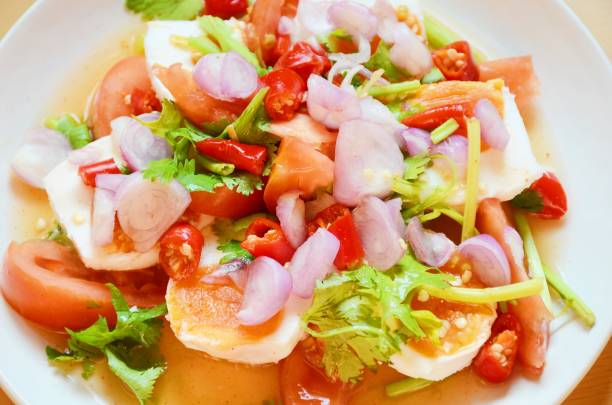 istock Spicy salad with salted eggs ( Thai food) 1138838602