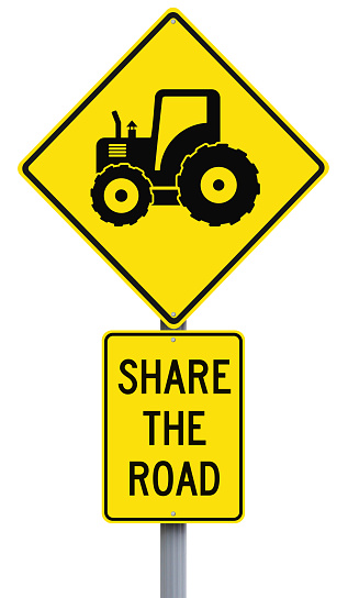 Road signs on sharing the road with tractors