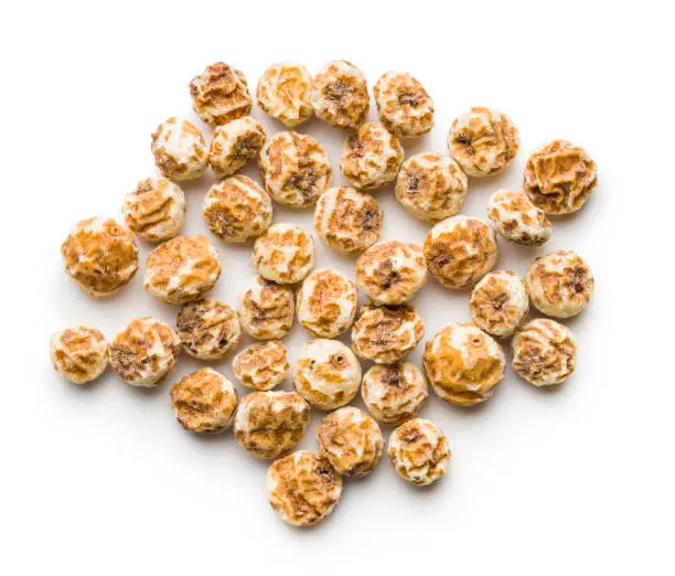 Tiger nuts. Tasty chufa nuts. Healthy superfood isolated on white background.