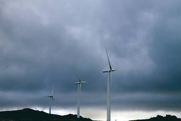 istock Wind turbines against stormy sky 1138840267