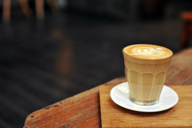 istock Cup of coffee on table in cafe - vintage style effect picture 1138841590