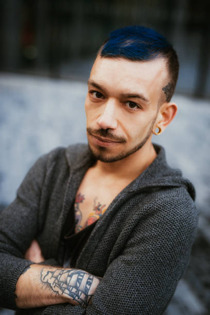 istock Alternative lifestyle millennial man with tattoo and piercing 1138842276