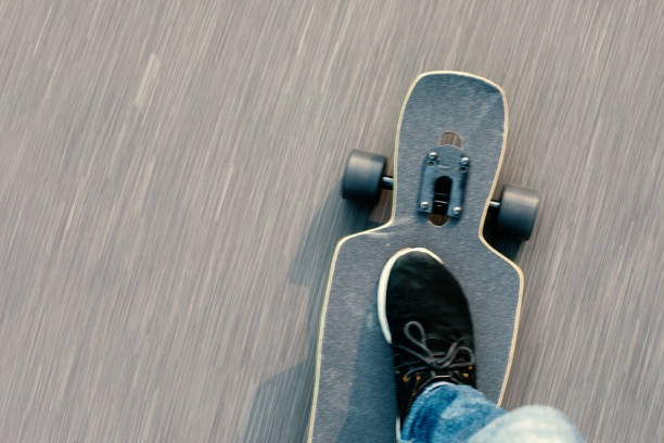 istock slide longboard on the asphalt 1138842308