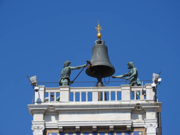 istock Zodiac clock. Clock Tower with winged lion and two moors striking the bell - early Renaissance 1497 building in Venice, located the north side of Piazza San Marco, Italy, Europe. 1138843498