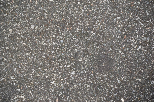 istock destructed tar road in a town 1138843694